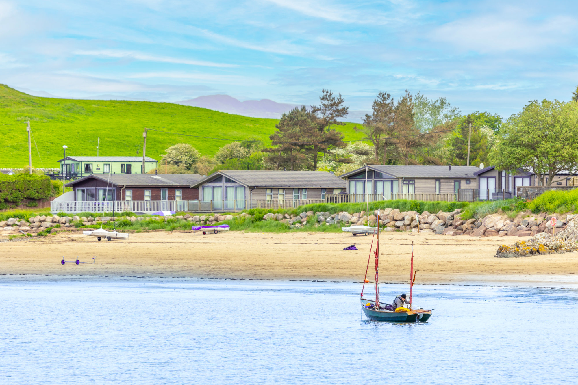 Holiday homes on the beach at Sandgreen Caravan Park