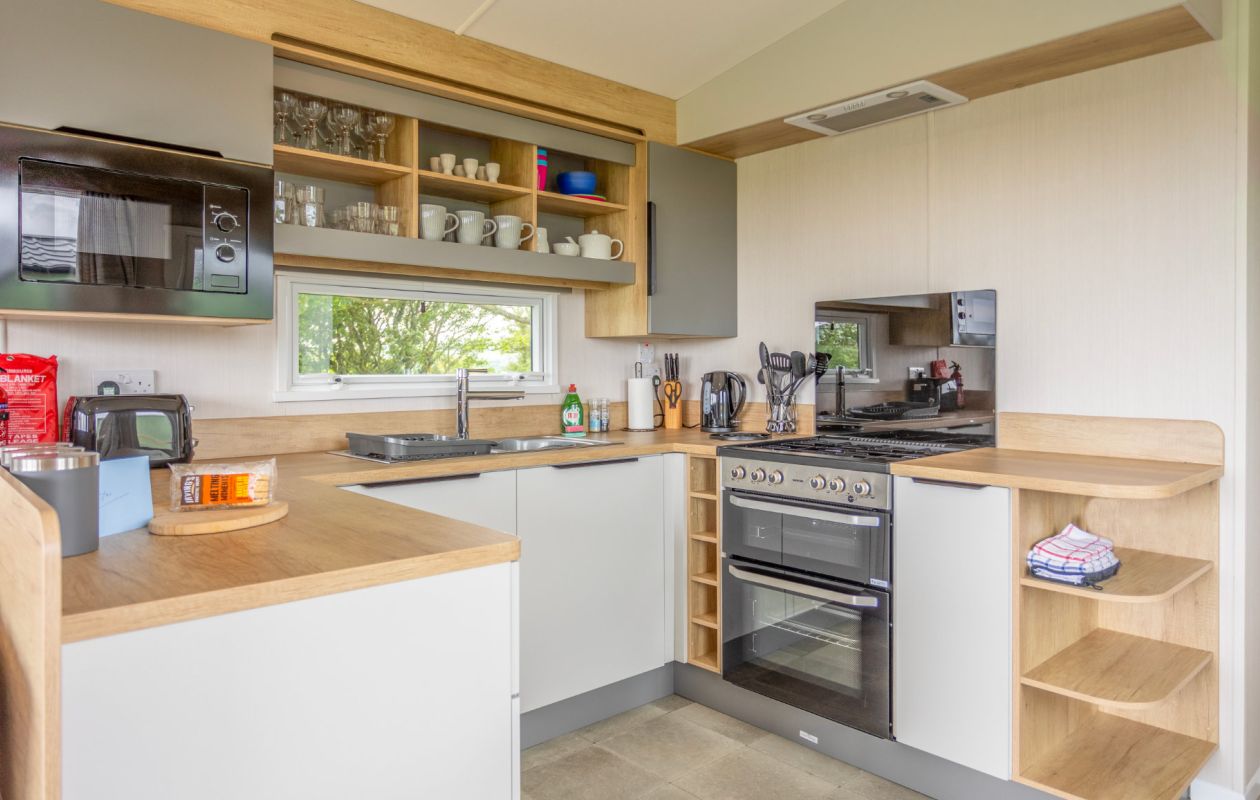 Holiday home kitchen at Sandgreen Caravan Park