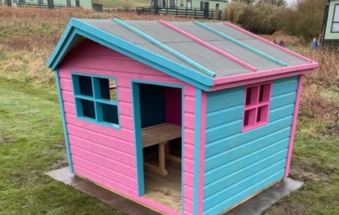 The wendy house in the play park at Sandgreen Caravan Park