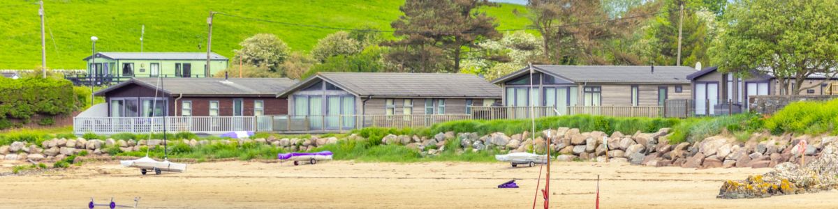 Holiday homes on the beach at Sandgreen Caravan Park
